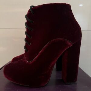 Potak burgundy lace-up platform bootie.